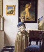 JanVermeer A Young Woman Standing at a Virginal oil painting artist