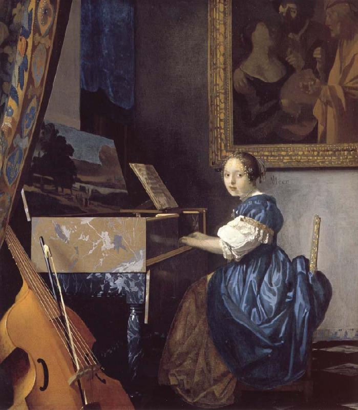  A Young Woman Seated at a Virginal